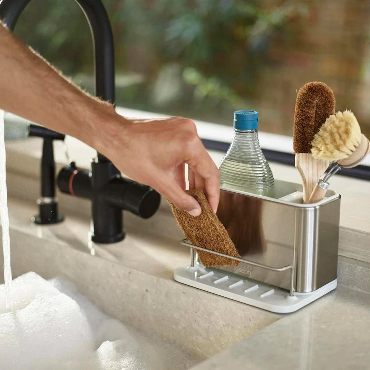 Organizador de fregadero plateado en acero inoxidable