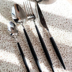 Set de 24 cubiertos de acero inox con mango negro